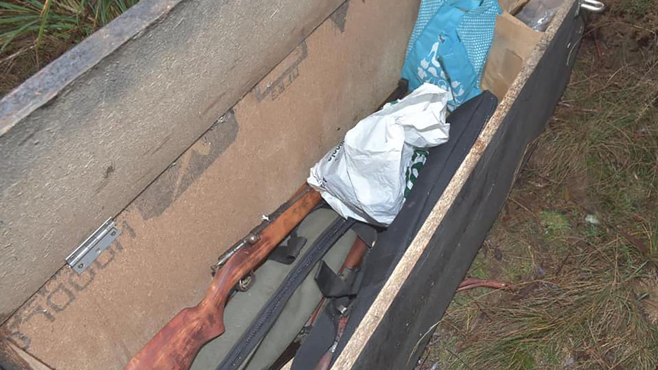 Ammunition, drugs and more than 20 firearms have been found in hidden bunkers in regional Tasmania.