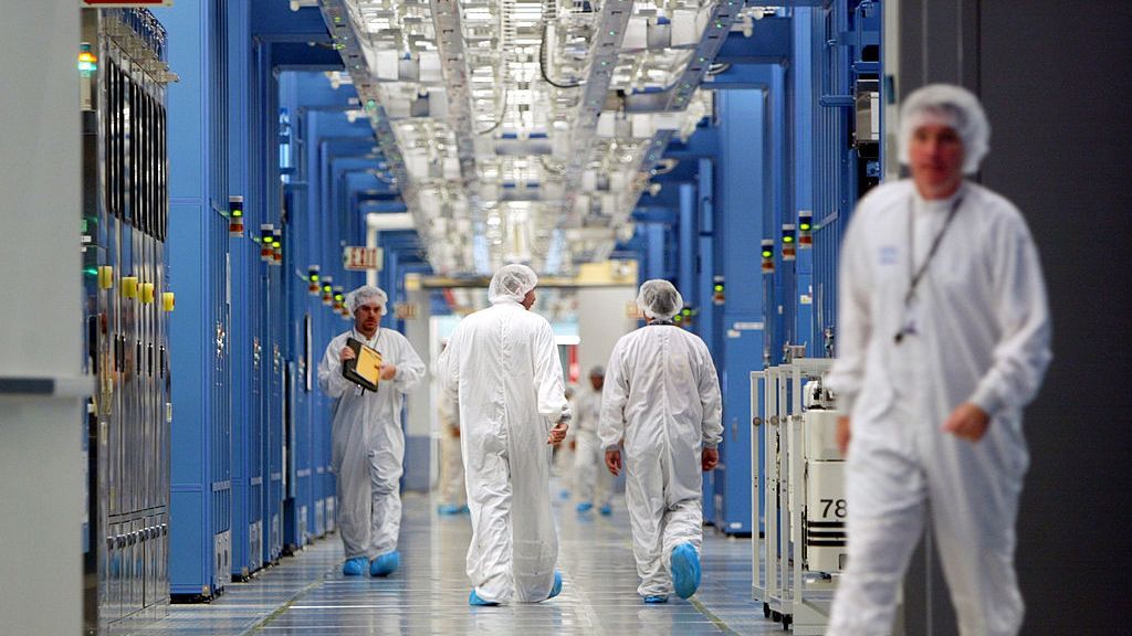 IBM Fabricating PlantIBM workers walk in an IBM 12-inch wafer chip fabricating plant July 20, 2004 in Fishkill, New York. (Photo by Mario Tama/Getty Images)